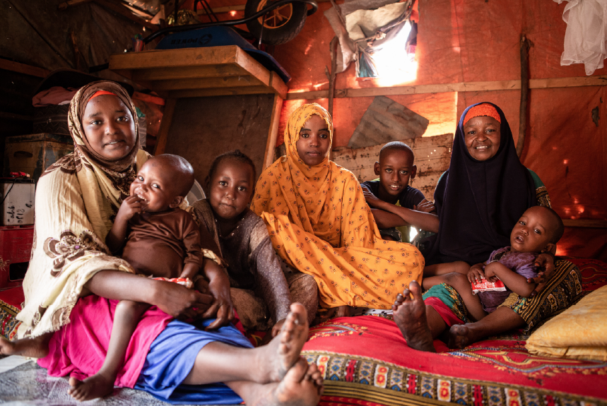 Abdiqani Abdihakim, (far left) with his mother Khadija Ibrahim and the rest of their family members at the Kahda Internally Displaced persons camp outside of Mogadishu, Somalia