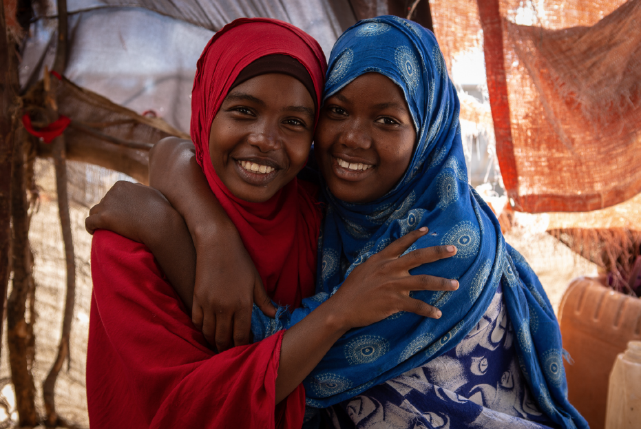 A portrait of Amran Mohamed, 18 yrs (left) and Hawa Ahmed, 18 yrs (right) at Amran's home in Kahda IDP camp in Mogadishu, Somalia.
