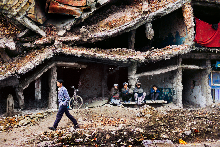 Returning war refugees sheltering in this destroyed building in Kabul.