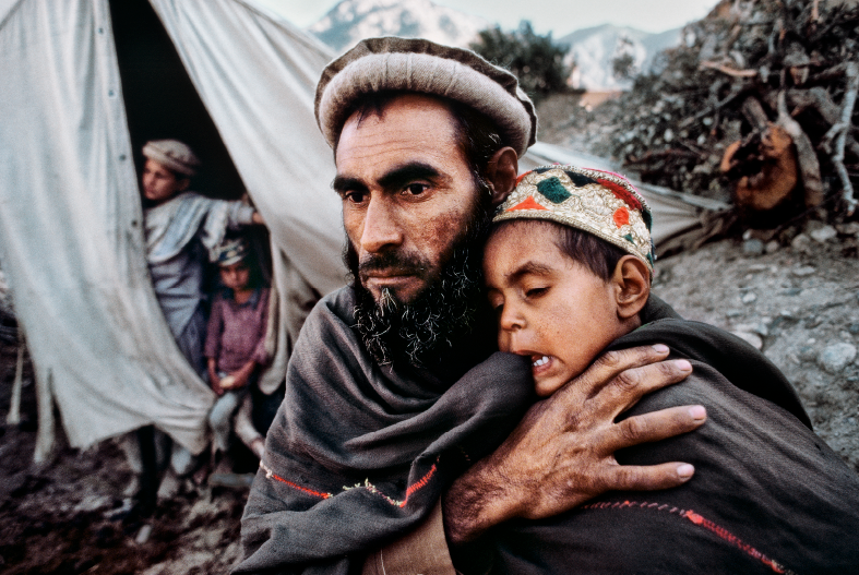 Father and son in a refugee camp in Pakistan's Chitral Valley.