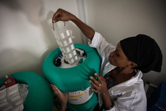 medical worker with vaccine vials