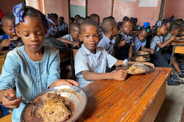 children enjoying school meal