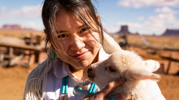 young girl with goat