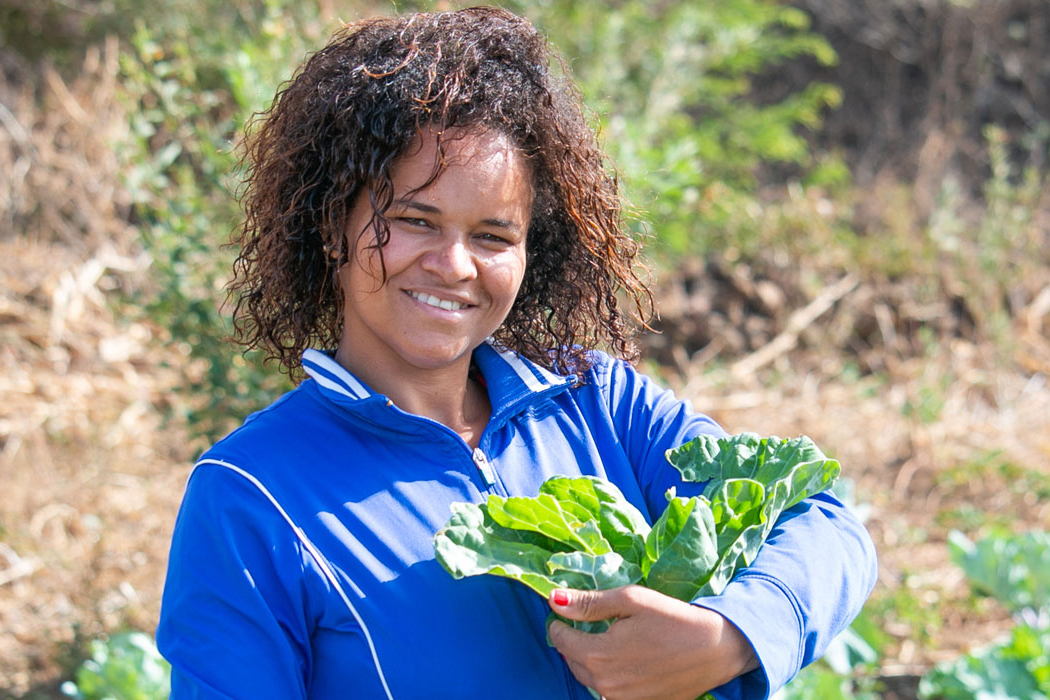 woman holding plant