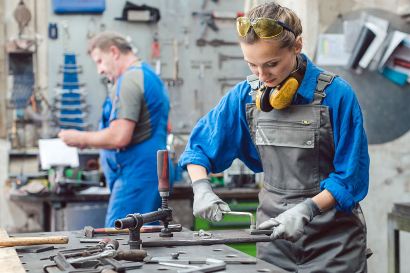 man and woman working in hardware shop