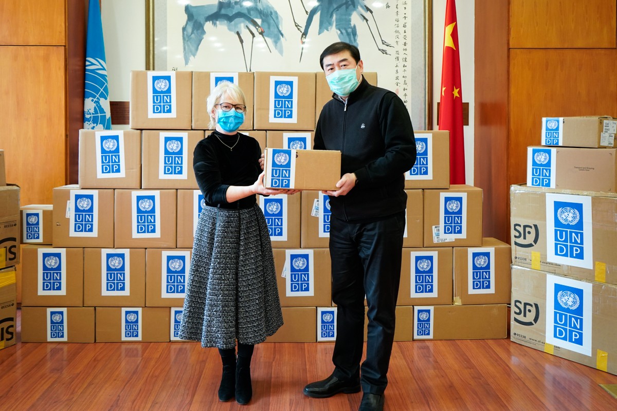 Handover ceremony at UN compound in Beijing for donation of critical medical supplies to the Chinese government.