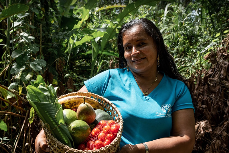 woman holding fruit basket