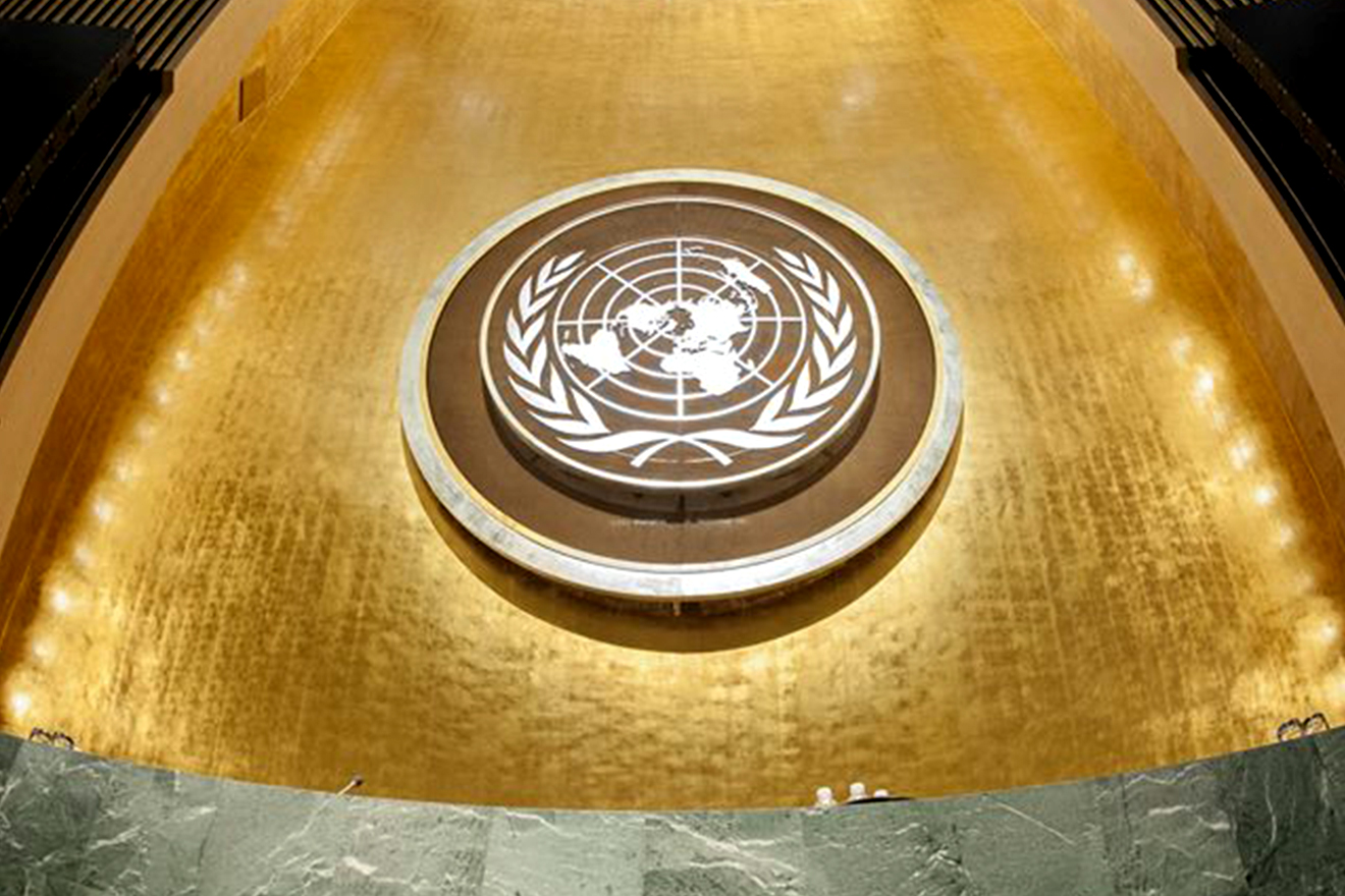 Photo of the UN Emblem in the General Assembly hall at the secretariat in New York.