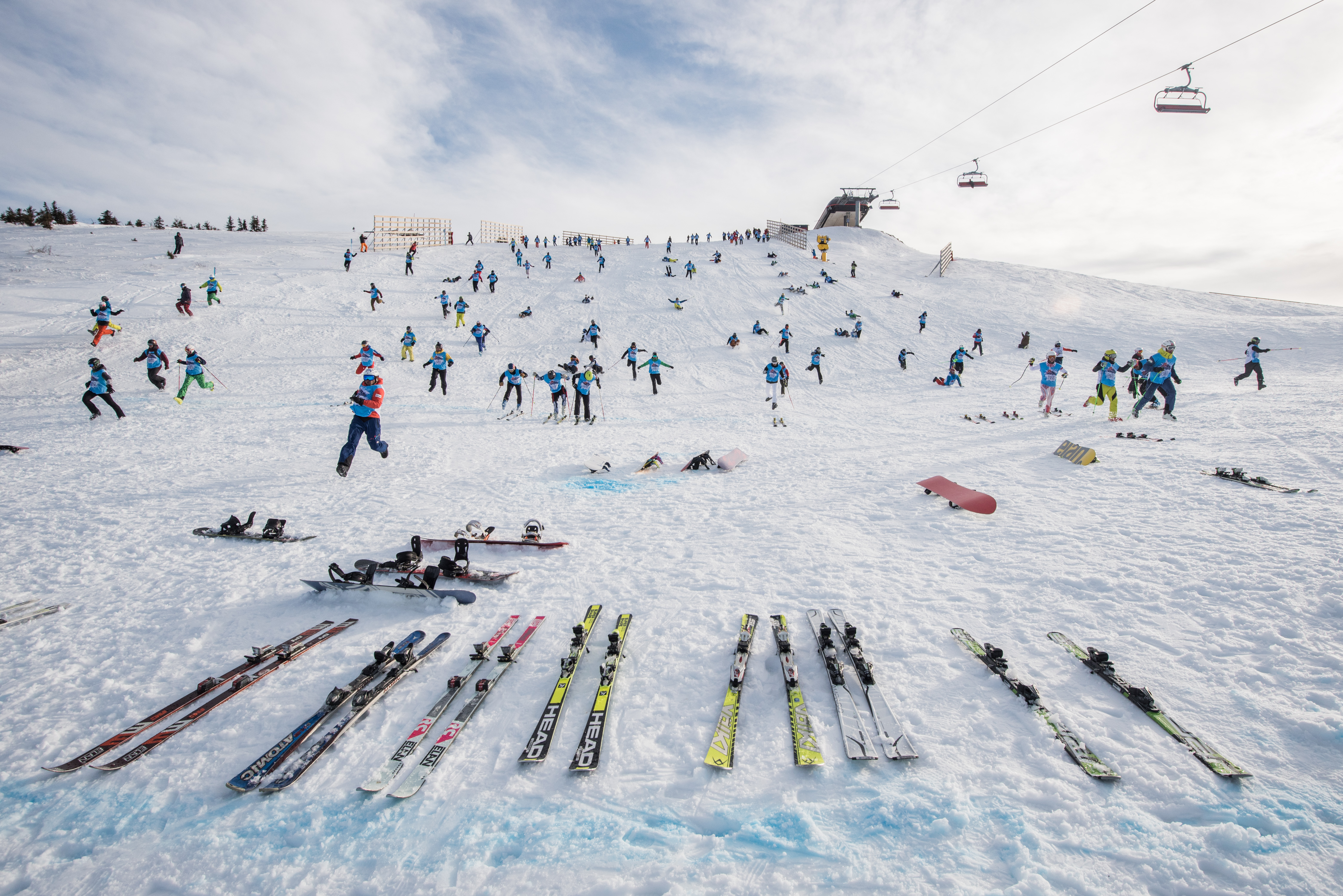 people running down a snowy mountain