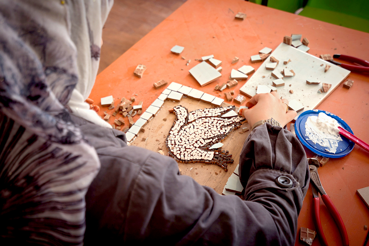 woman working on an artwork