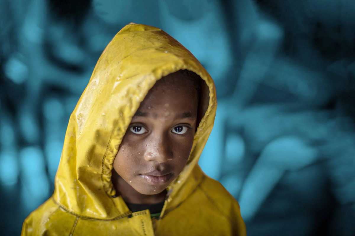 Portrait of a boy wearing a rain coat.