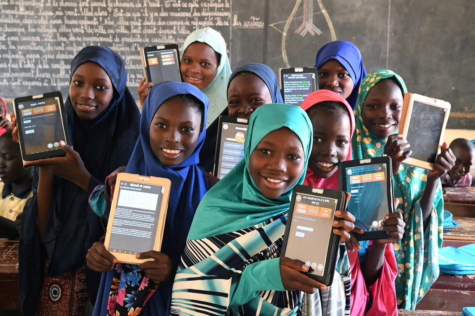 Children attending class with their tablets in Niger