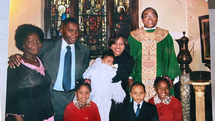 Selwin Hart and his family pose for a photo at church with the minister