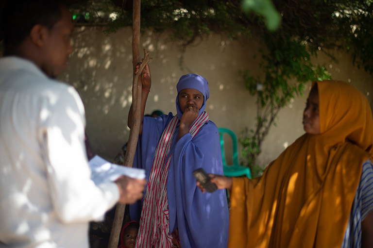  young woman registers for an aid package at an IOM-funded Migrant Response Centre in Hargeisa, Somalia.