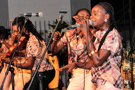 people performing music and dance on stage