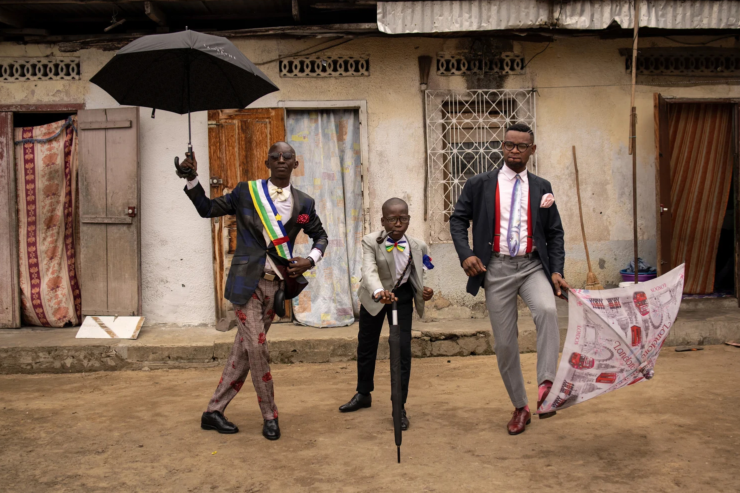 two men and a boy dressed as dandies