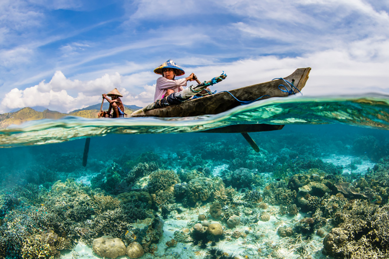 Two people fishing in a canoe 