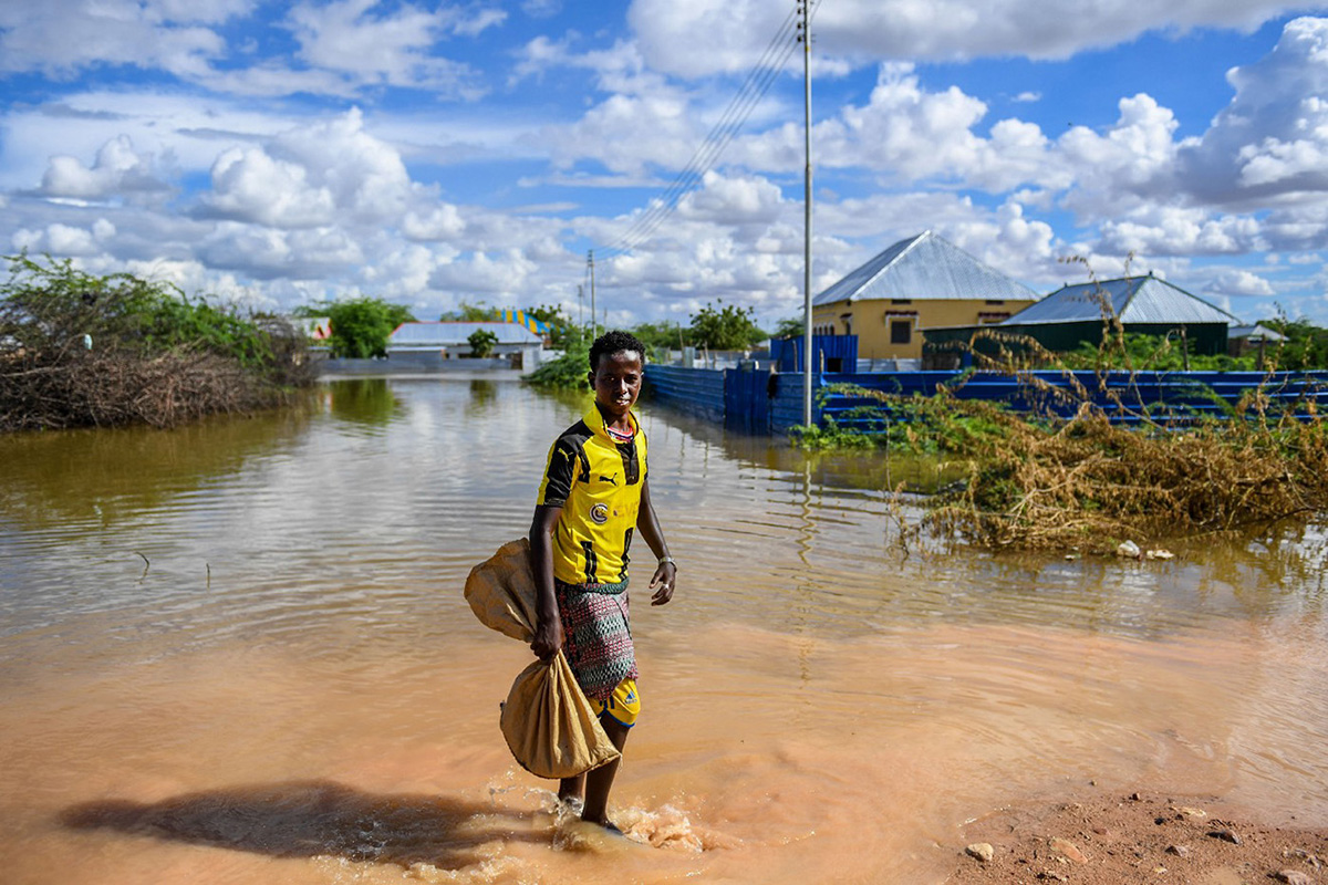 a young boy in a flooded village