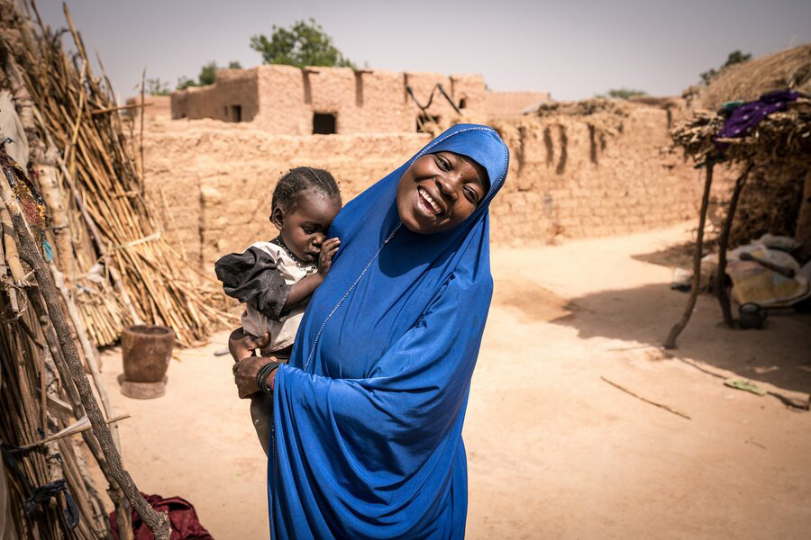 smiling mother with young child