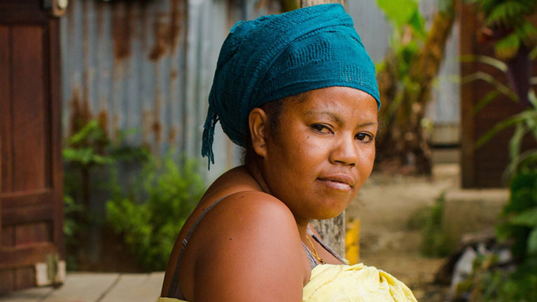 Portrait of a woman wearing a turban. 