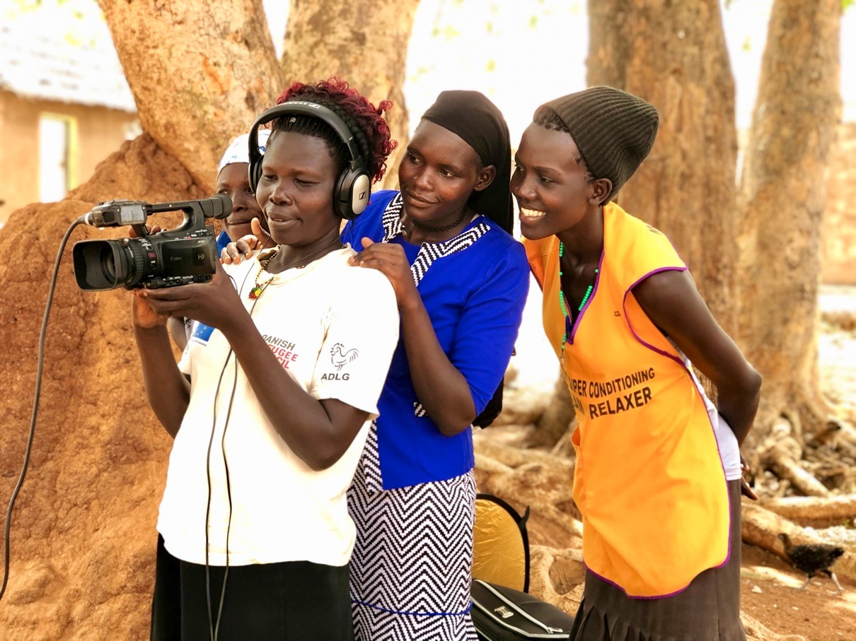 Refugee women learn participatory communication skills using video.