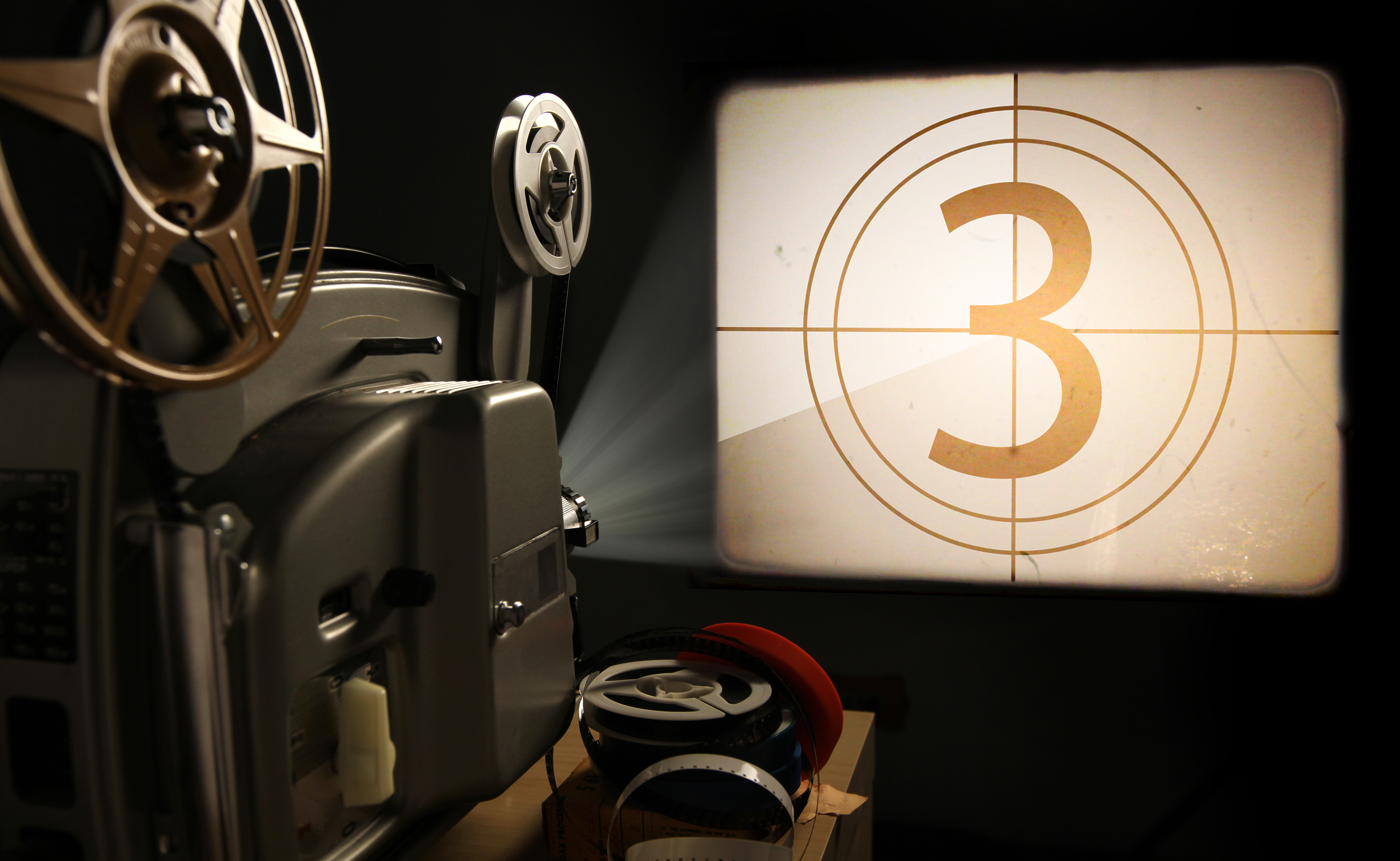 a film projector projecting a countdown