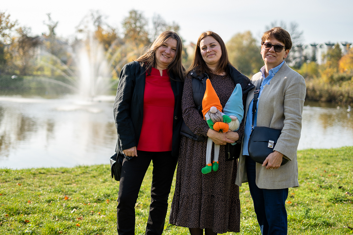 Tatiana (middle) is holding two dolls and standing with Magdalena and Katarzyna. 