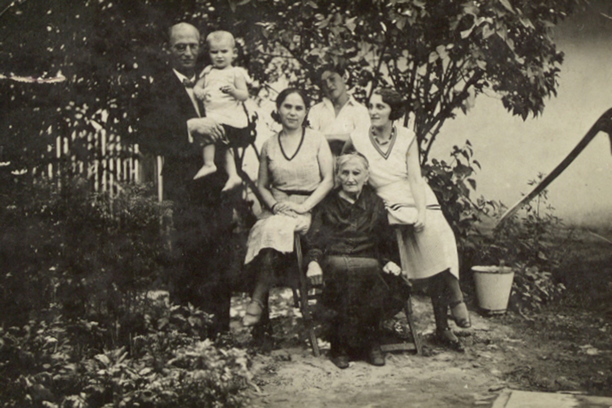 A black and white photo of a family