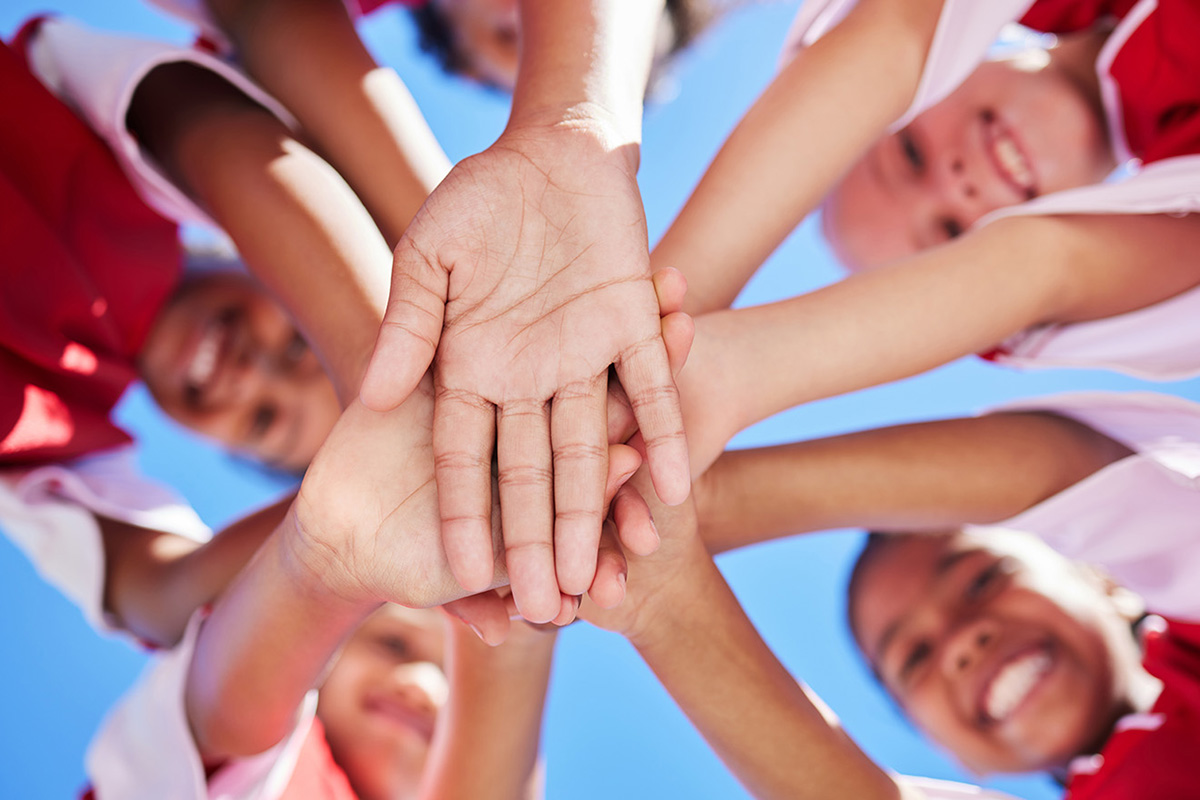 kids with hands together