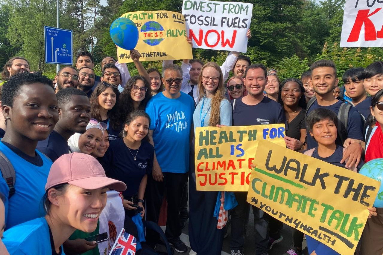 A group of young people at a rally with WHO Director-General Dr Tedros Adhanom Ghebreyesus