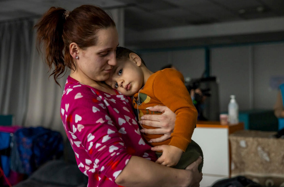 a woman holds a child