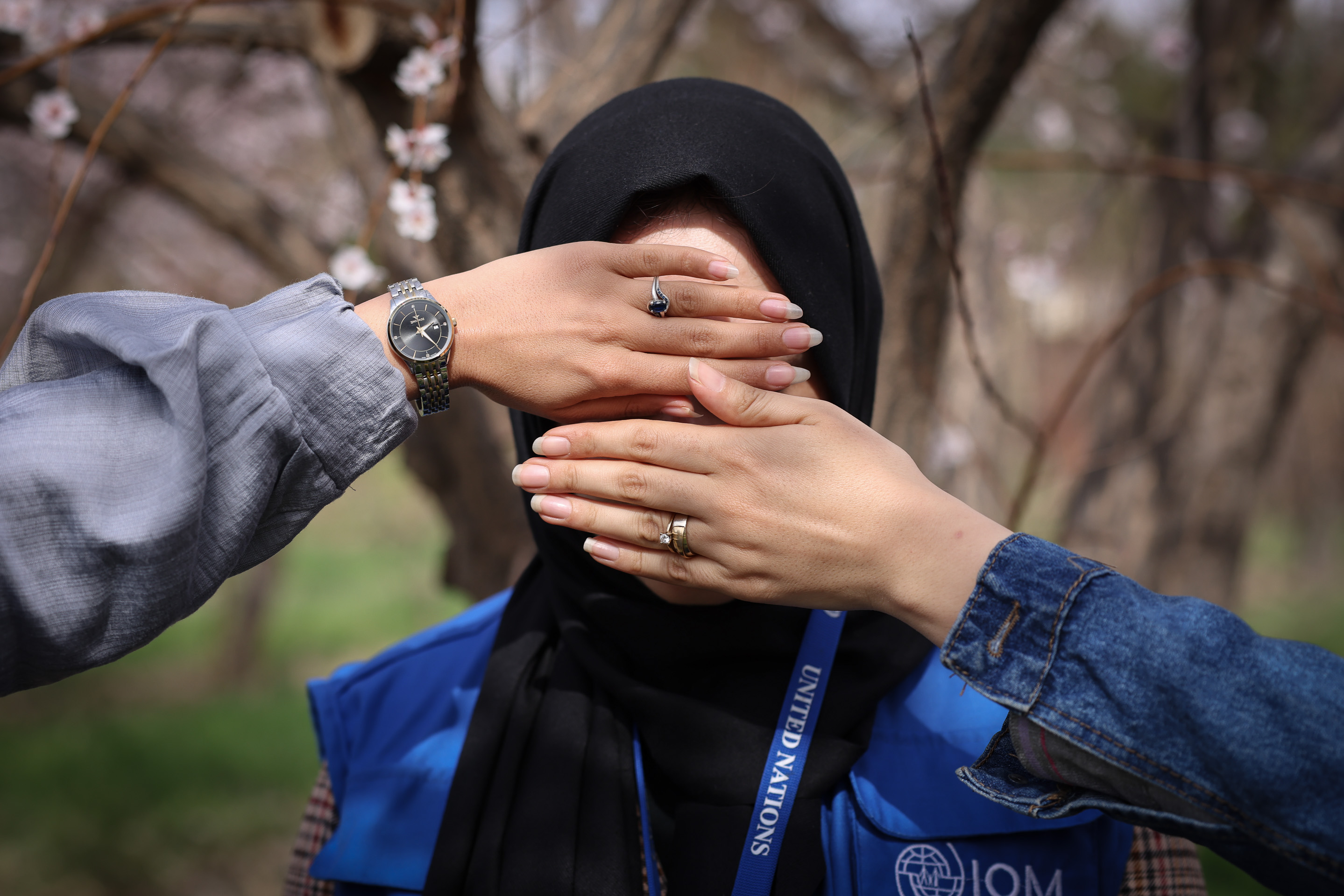 hands in front of woman's face