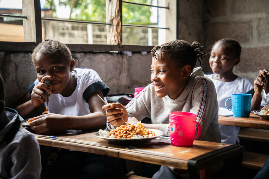 Students eating hot meals at their school desks