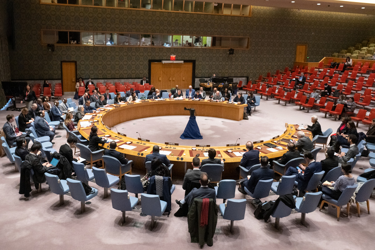 Delegates sit at the open round desk at the Security Council