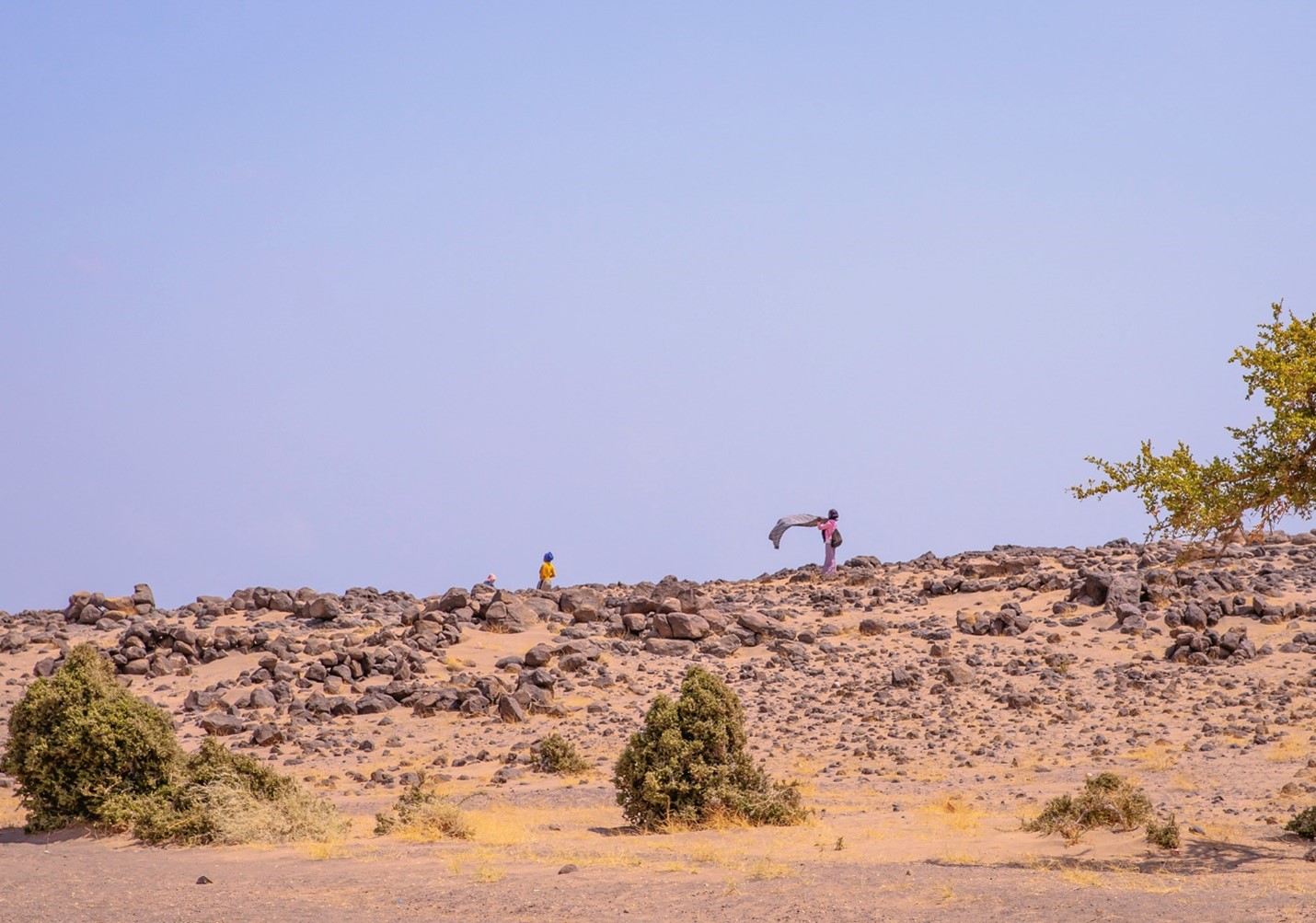 two women on a hill in Djibouti desert