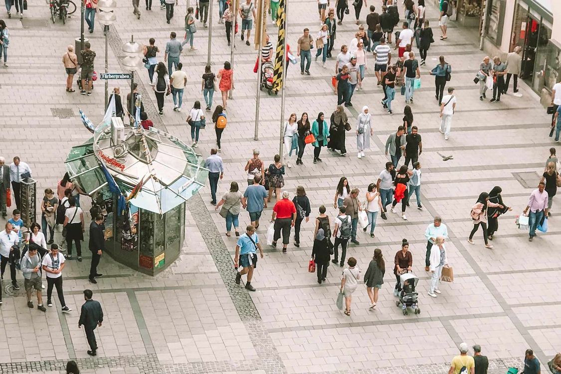 People walking down a pedestrian street