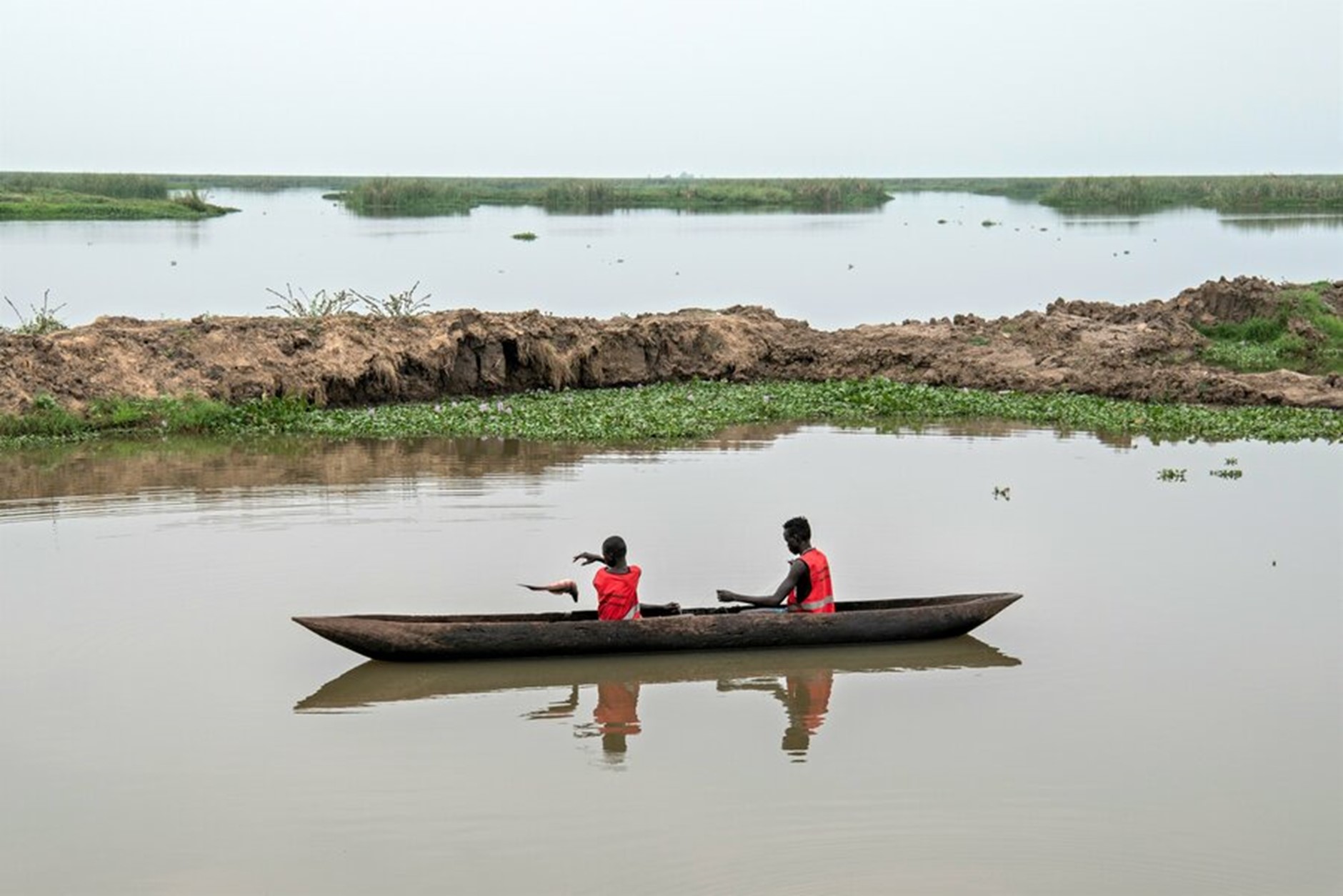 Two boys on a river