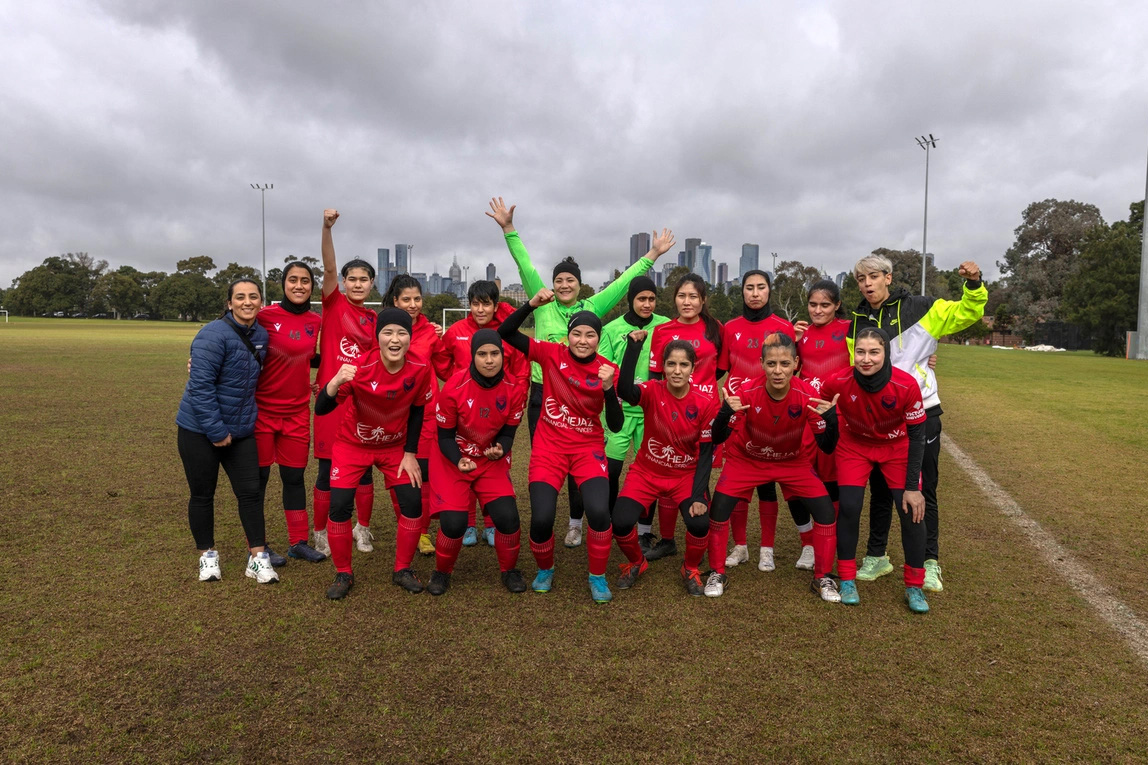 Women footballers enjoying a victory moment