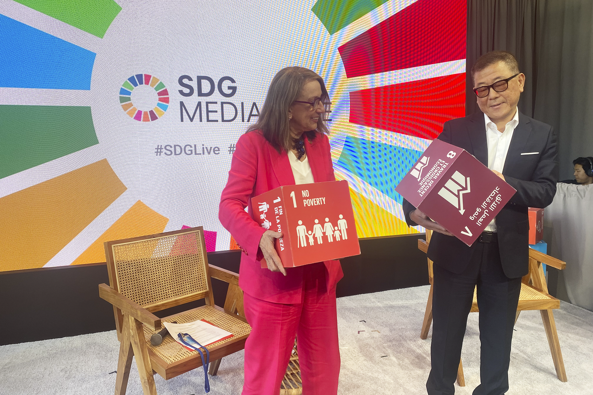 people holding up SDG cubes