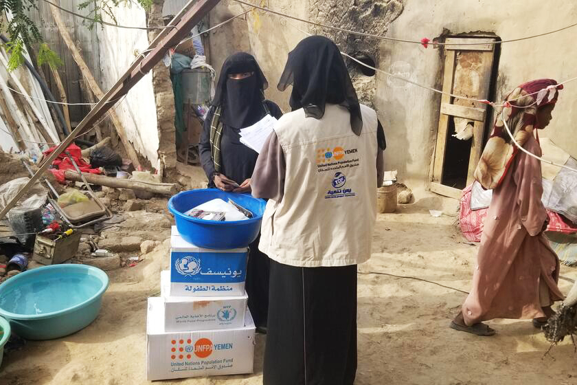 family in Yemen receiving supplies