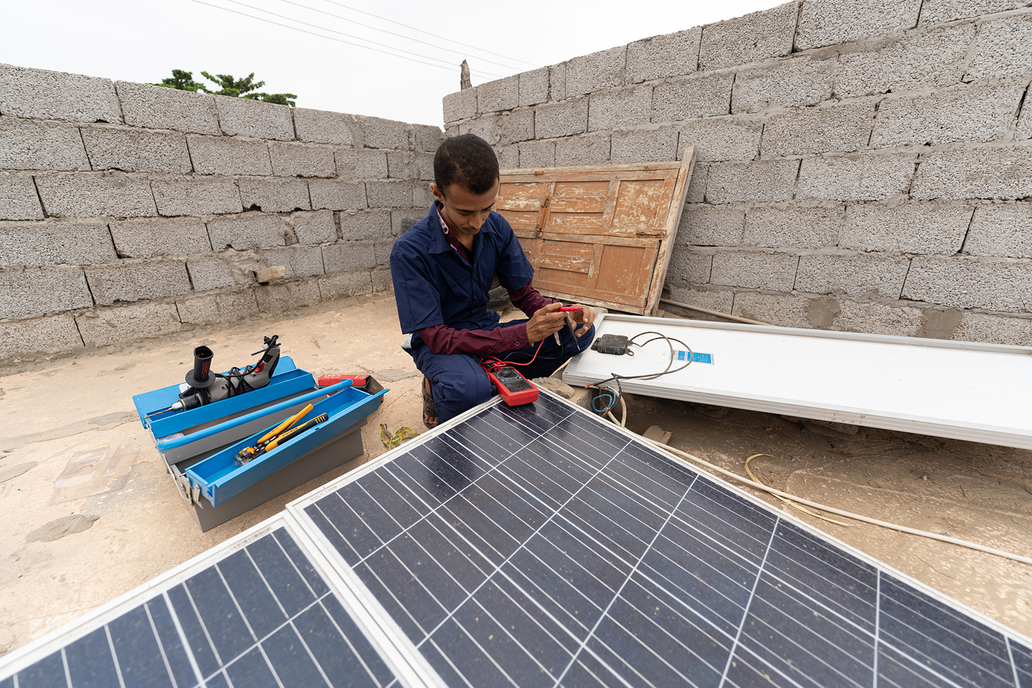 young man with solar panels