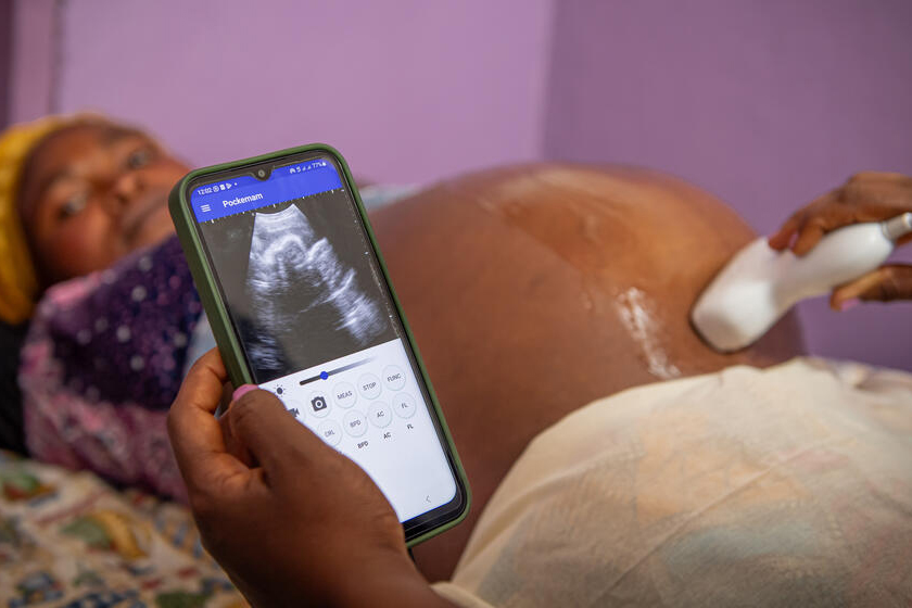 Pregnant woman receiving an ultrasound service. 