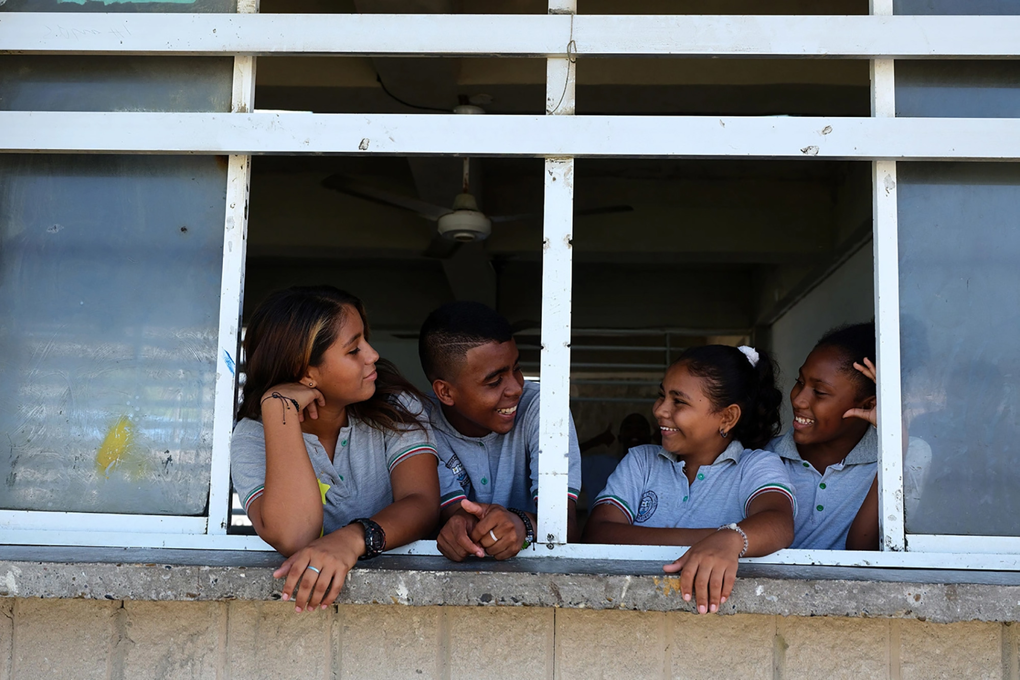 Four venezuelan teenagers in a Colombian school. 