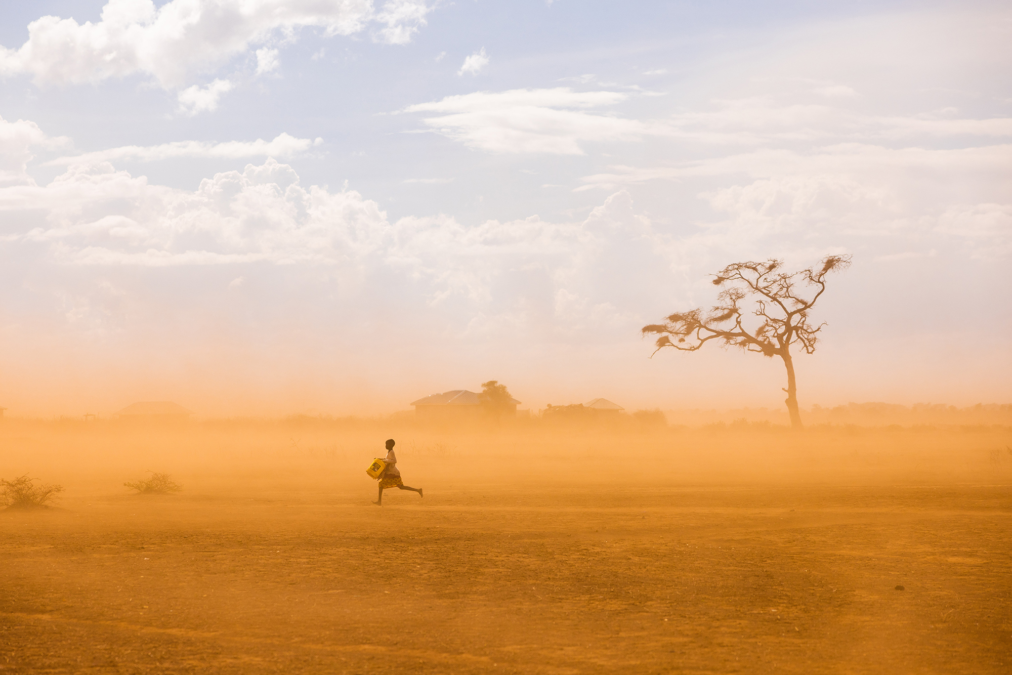 Desert landscape with a girl running