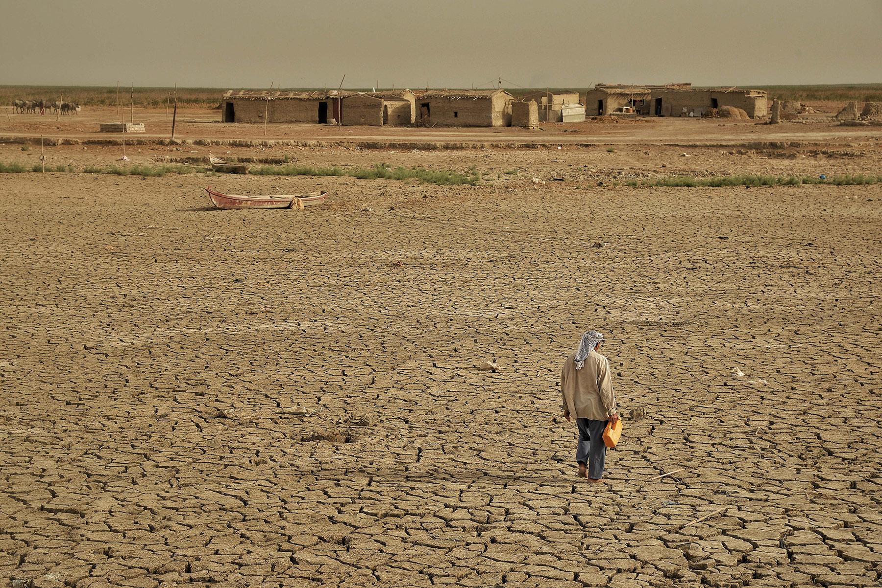 A man walking on dried land