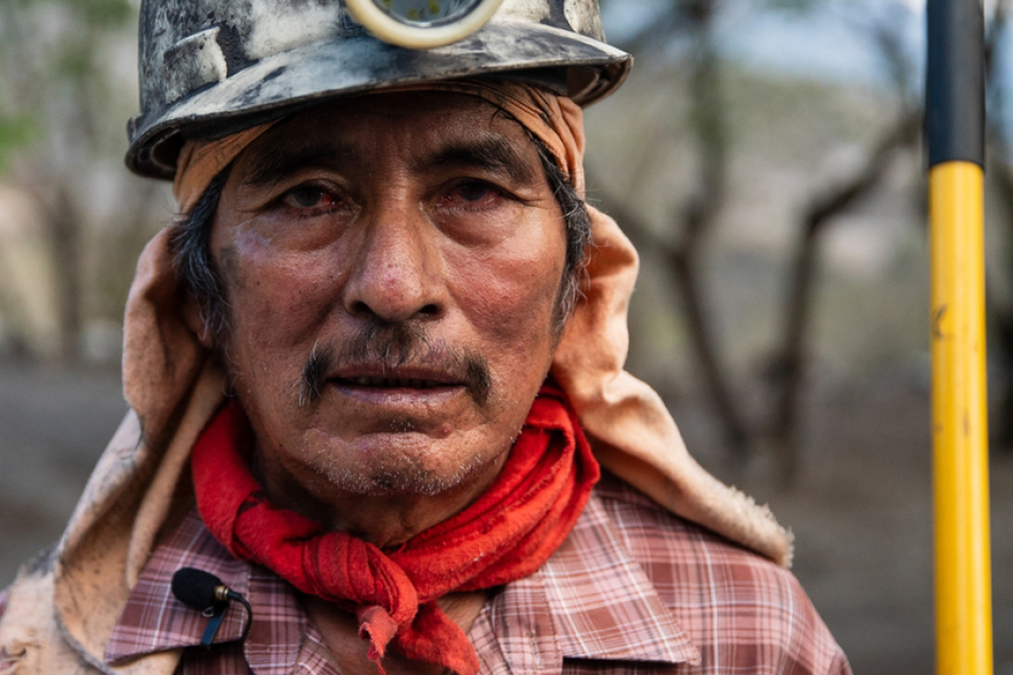 Close-up of a Mexican miner wearing a helmet.