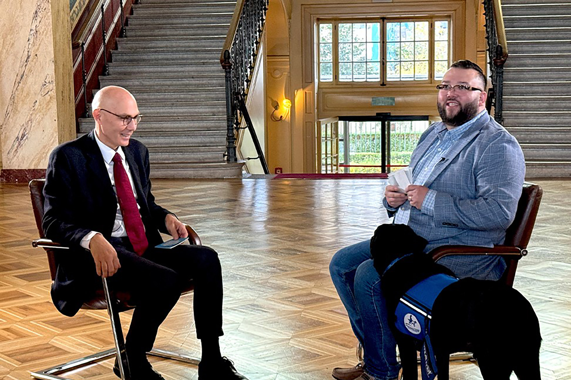 A trafficking survivor and his service dog meet with the UN High Commissioner for Human Rights.