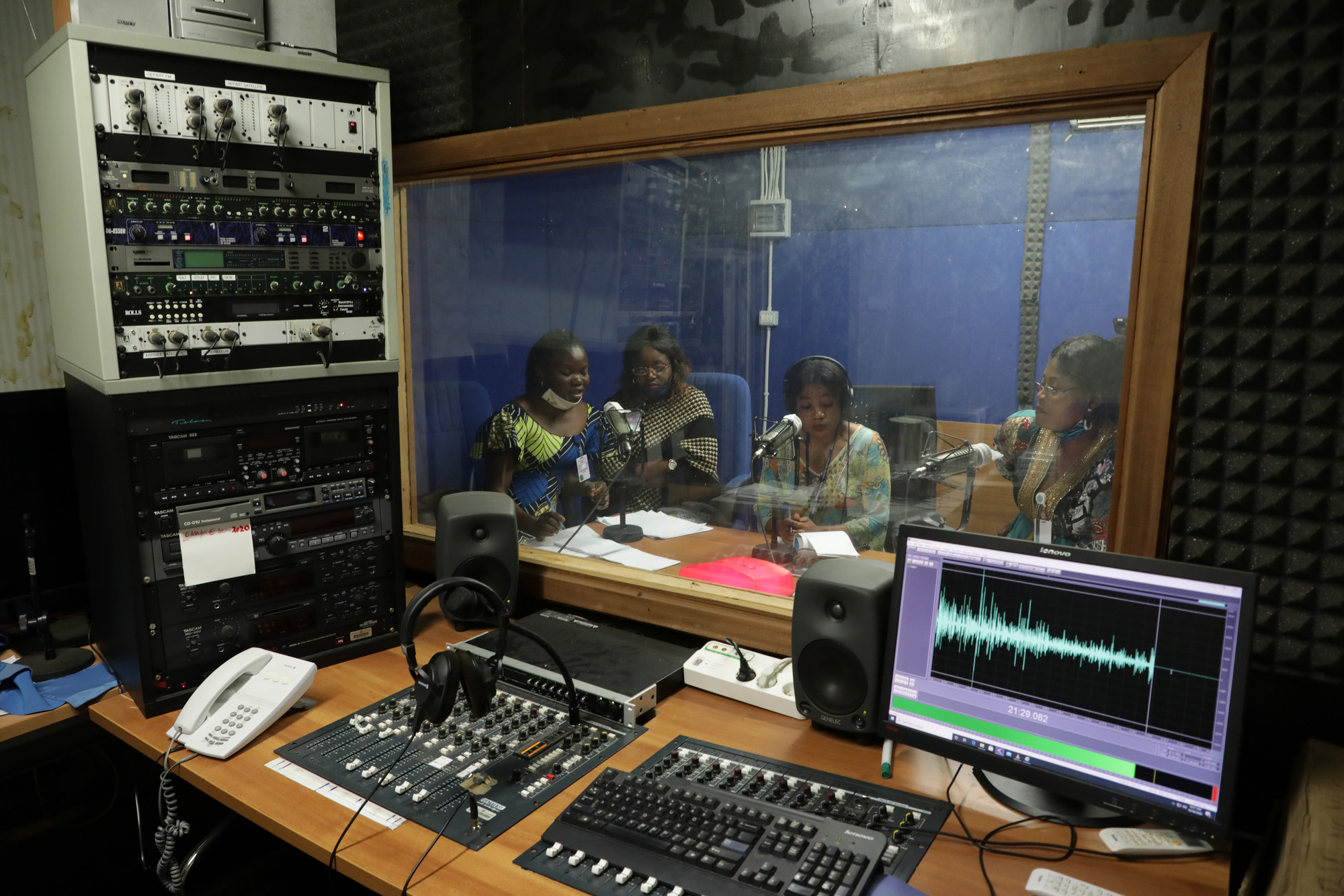 group of women in recording room of radio studio