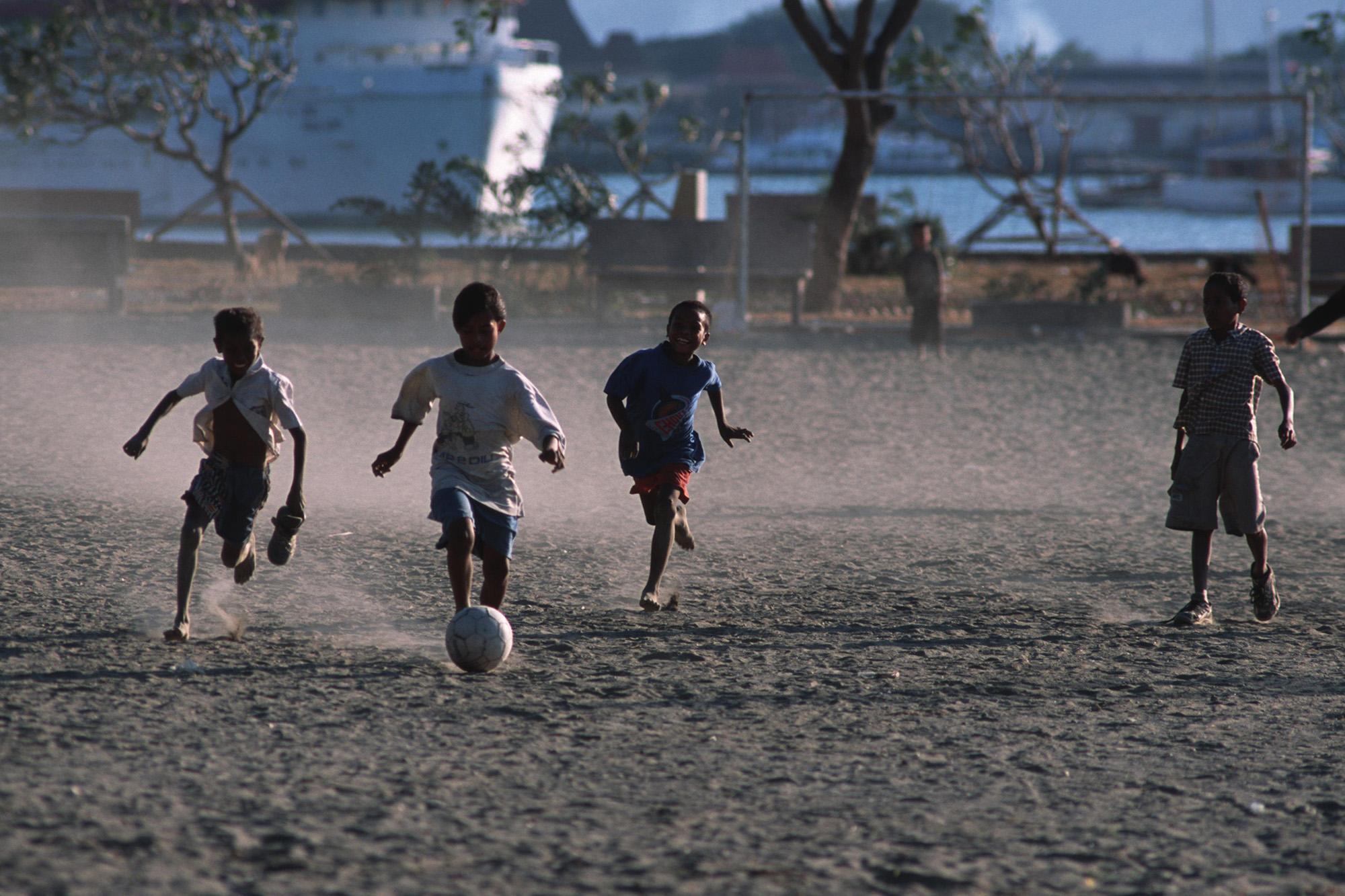 Children playing football (soccer) in Timor-Leste.