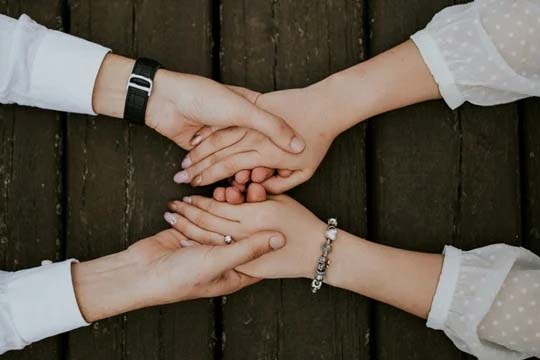 two people holding hands
